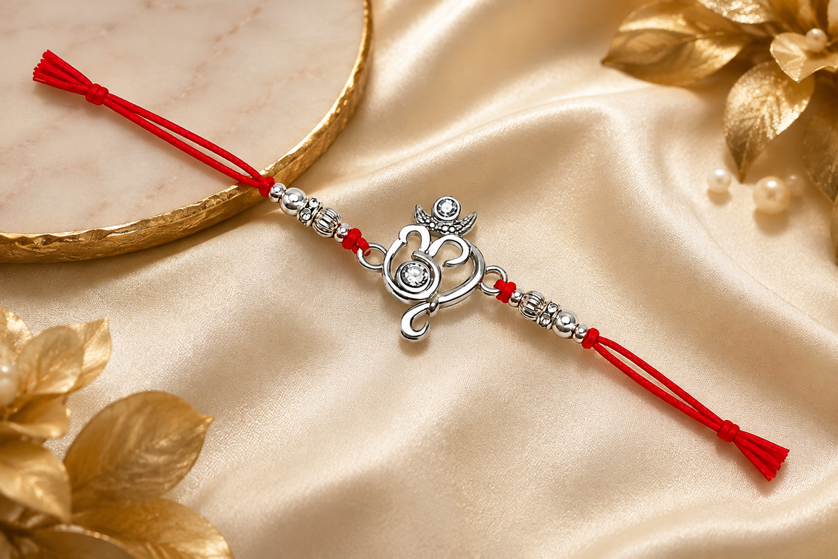 Elegant Silver Om Rakhi with Red Mauli Thread