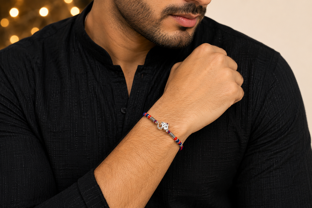 Divine Om & Ganesha Silver Rakhi with Red & Blue Beads